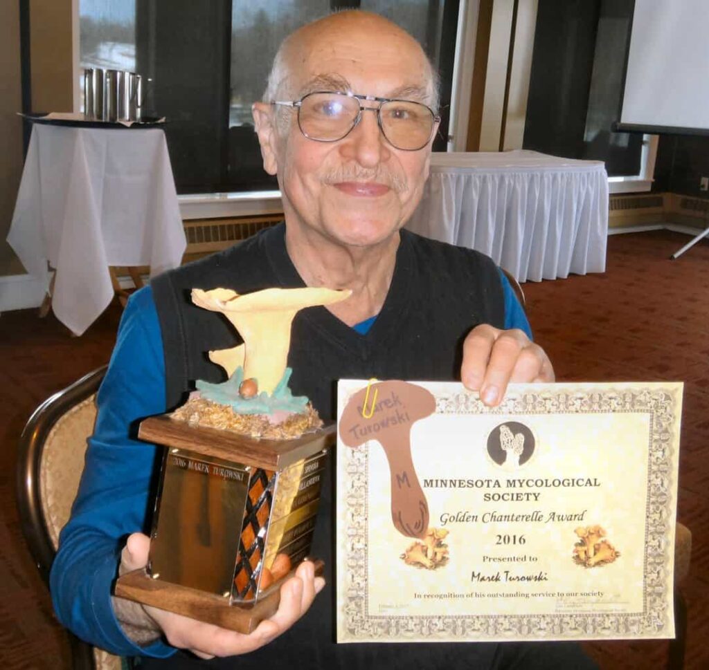 Marek Turowski with his Golden Chanterelle Award trophy and certificate at the 2017 MMS Banquet. 