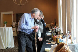 Attendees looking at Silent Auction Items